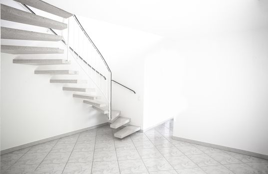 twisted staircase in clean white building leading up to second floor with white walls and doors