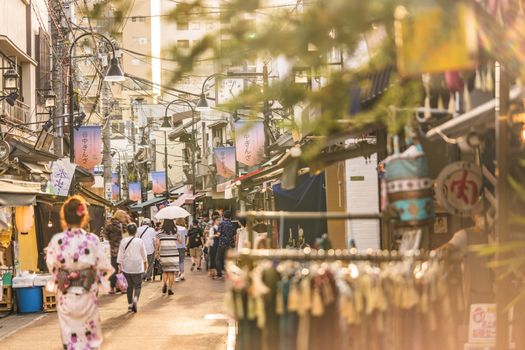 The famous Yuyakedandan stairs which means Dusk Steps at Nishi-Nippori in Tokyo lead to an old-fashionned shopping street of Yanaka Ginza famous as a spectacular spot for sunset. Yanaka Ginza is also named the Evening Village.