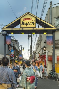 Retro old-fashionned shopping street Yanaka Ginza famous as a spectacular spot for sunset golden hour from the Yuyakedandan stairs which means Dusk Steps at Nishi-Nippori in Tokyo. Yanaka Ginza is also named the Evening Village.