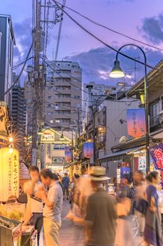 Retro old-fashionned shopping street Yanaka Ginza famous as a spectacular spot for sunset and also named the Evening Village. Yanaka's mascot is a cat named Sen whose carvings on the roofs can be seen.