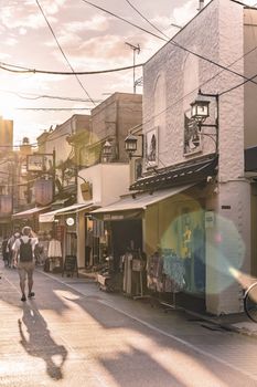 The famous Yuyakedandan stairs which means Dusk Steps at Nishi-Nippori in Tokyo lead to the old-fashionned shopping street Yanaka Ginza famous as a spectacular spot for sunset. Yanaka Ginza is also named the Evening Village.