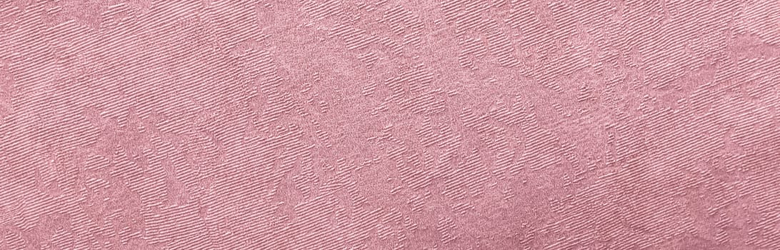 Abstract grungy decorative texture. Textured paper with copy space. The mottled surface of the paper is pink, texture closeup.