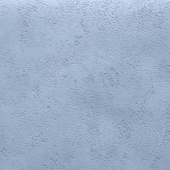 Abstract grungy decorative texture. Textured paper with copy space. Motley surface of blue paper, texture closeup.