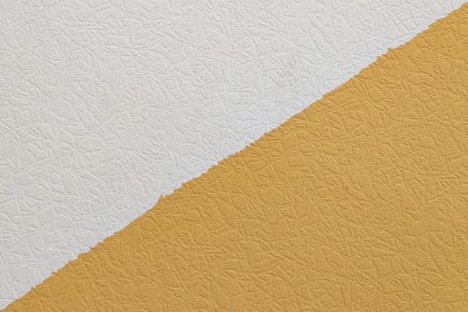 Abstract grungy decorative texture. Textured paper with copy space. The mottled surface of mustard yellow paper, texture closeup.