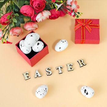 Festive Easter card with a bouquet of roses and a red box.