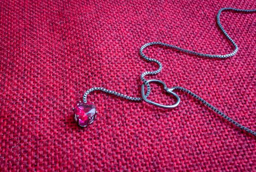 Silver pendant and choker with a heart shaped gem