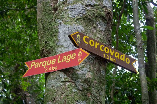 Signs on Transcarioca Trail, on Rio de Janeiro, indicating locations for Corcovado and Parque Lage