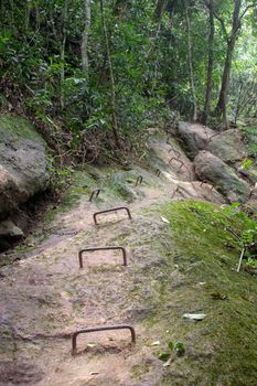 Steep part with chains and iron ladder on the rock of Parque Lage to Corcovado Trail, Rio de Janeiro, Brazil