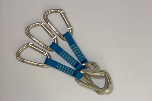 Tree rock climbing quickdraws, with aluminum carabiners and blue slings