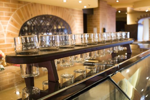 A set of pint glasses on a bar counter