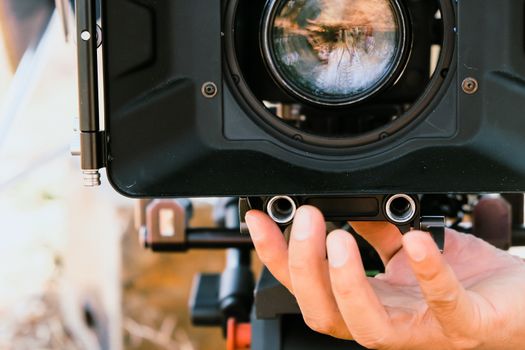 Film industry. Filming with professional camera background