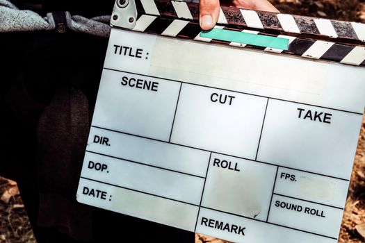 Film Slate, close up image of film production crew holding Film Slate on set