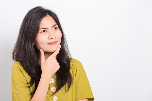 Portrait Asian beautiful young woman standing, She thinking or dreaming and looking up above, shoot photo in studio on white background, There was copy space on the left hand side