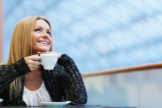 Portrait of a beautiful lady drinking afternoon coffee