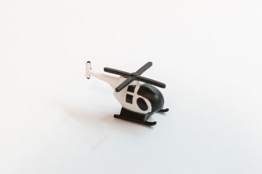 Small colorful helicopter toys isolated on a white background - air travel by helicopter concept.