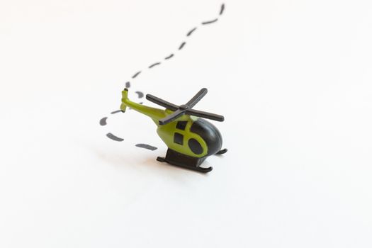 Small colorful helicopter toys isolated on a white background - air travel by helicopter concept.