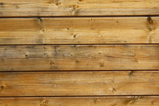 The picture shows a background with brown wooden boards