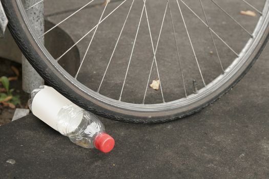 plastic bottle tossed on the ground. Plastic wast destroying the planet