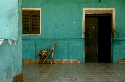 green wall with door and chair in egypt