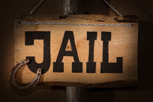 crime does not pay - Jail sign hanging on a door