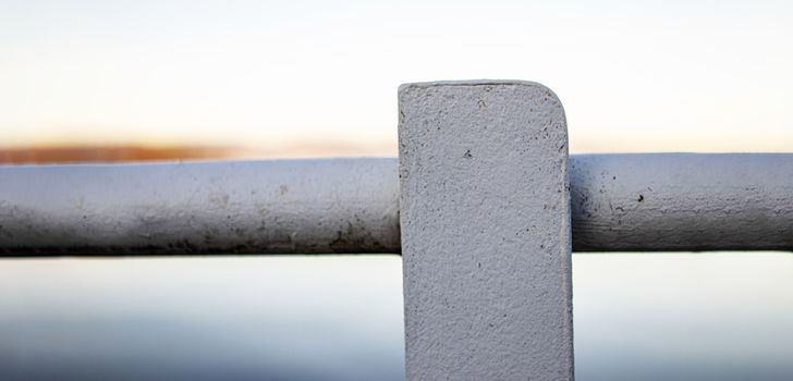 iron security railing painted white with copy space and out of focus background