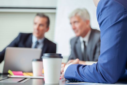 Business people working with documents in conference room