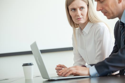 Business people working with laptop together in office copy space for text