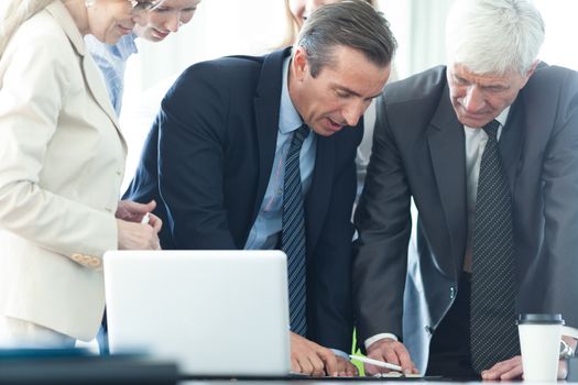 Team work process, business people sign contract documents standing near the table