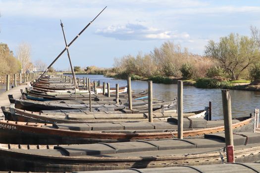 Jetty, boats and clouds in the background