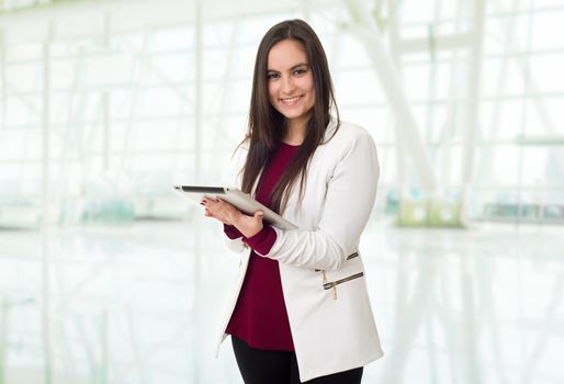 young business woman with a tablet pc, at the office