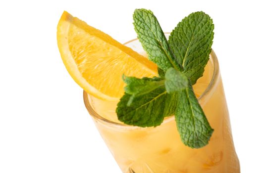 Cold multi fruit cocktail drink with slices of orange, mint leaf isolation on a white