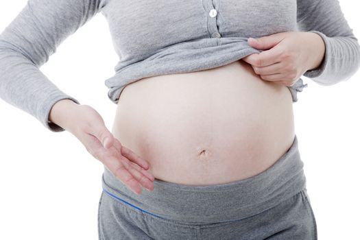 Closeup of pregnant woman at white background