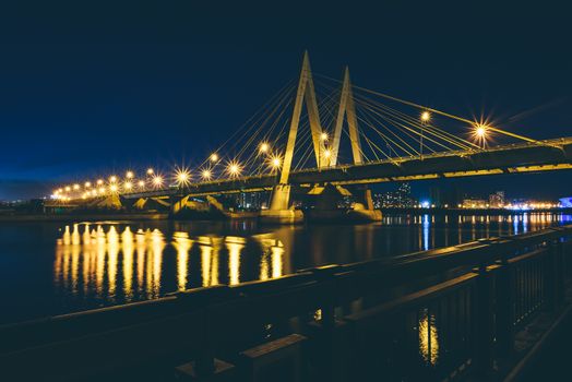 Millennium bridge at night. View from Kazanka river Kremlin embankment