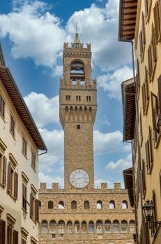 Ancient stone clock tower in Florence, Italy