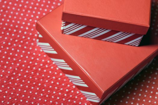 Christmas gift boxes on a red wrapping paper