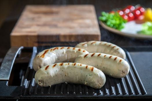 Mouth-watering chicken roasts grilled on the surface