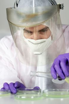 Scientist working in the corona virus vaccine development laboratory research facility. Corona virus pandemic concept. Development of virus treatment drug.