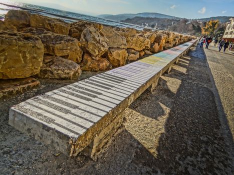 A piano locking stone railing near the sea coast.