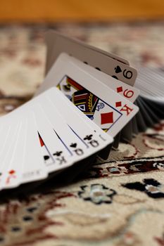 A deck of playing cards arranged like if doing a ribbon spread