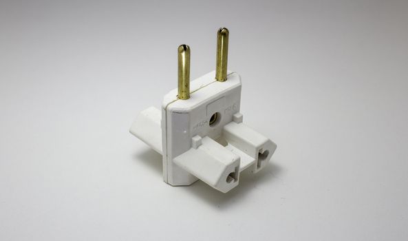 Travel power adapter made of plastic and metal for different electrical socket standards