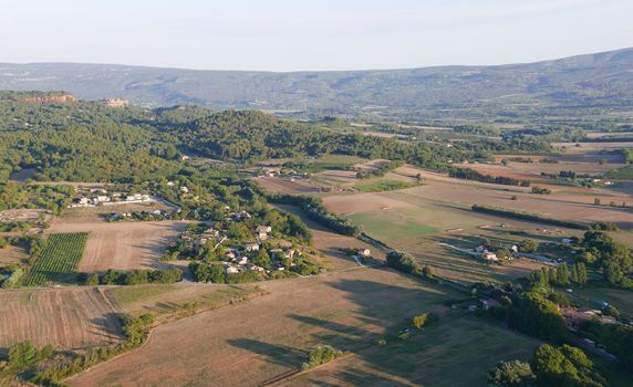 hot air balloon flight in the vaucluse above the village of Roussillon, France