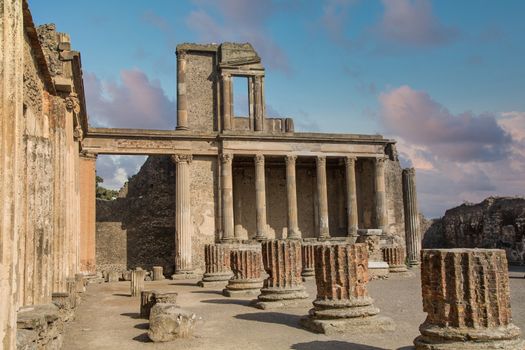 Broken walls and columns in the ancient ruins of Pompeii