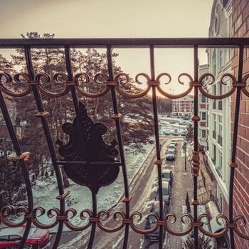 The view from the balcony of the city in the winter on snow-covered landscaped courtyard. New luxury house and residential complex with a convenient courtyard in Moscow. Modern urban real estate and condominium architecture.