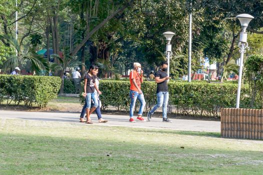 People walking in street wearing respiratory face masks to prevent spread of deadly corona virus as the city witness First Suspected Case of Coronavirus (COVID-19/2019-ncov) patient admitted last day. Kolkata India March 2020