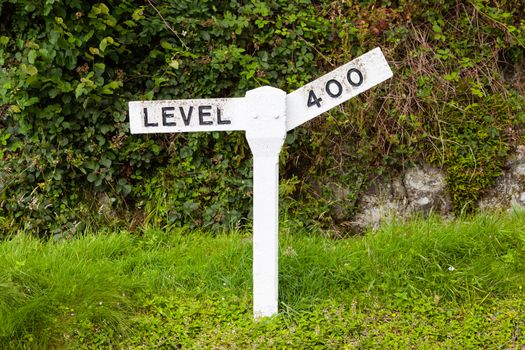 A railway gradient sign is pictured on a preserved railway in northern England.