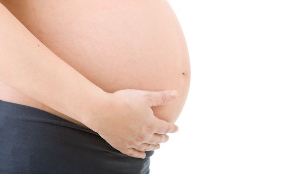 Closeup of pregnant woman at white background