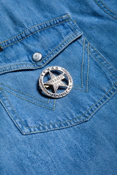 Star badge on a fabric background