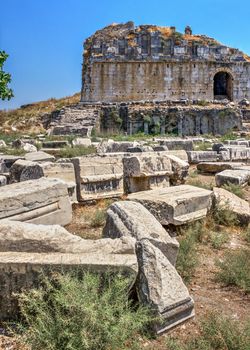 Huge stone blocks of the Ancient Theatre in the greek city of Miletus in Turkey on a sunny summer day