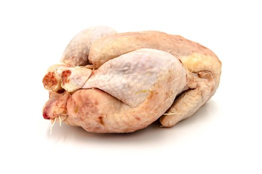 Raw hen on a white background. Broiler, ready to cook.