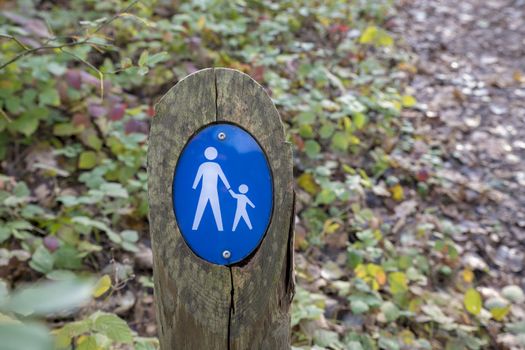 Sign parental supervision or walking area in the forest in blue